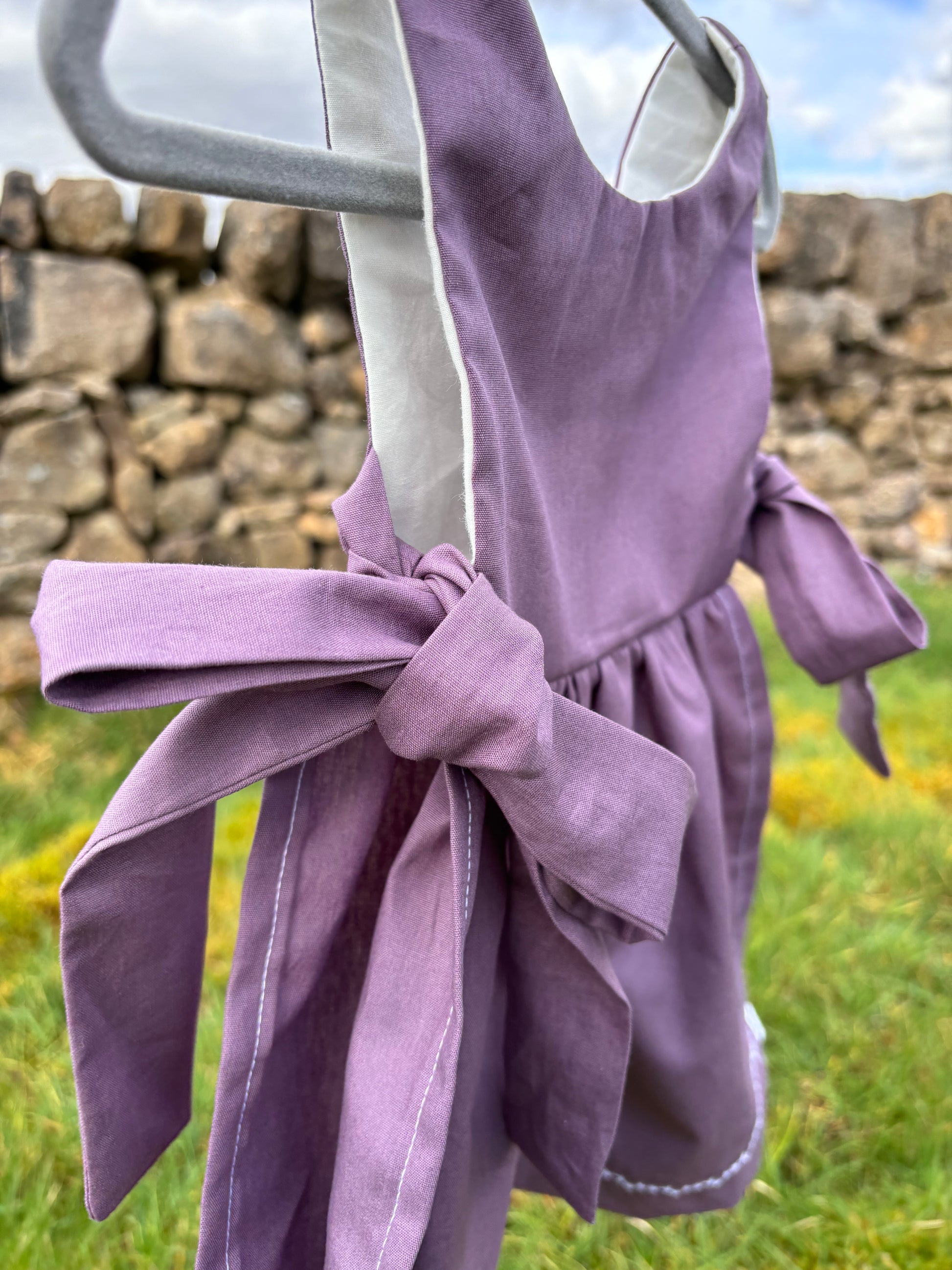 Organic cotton baby pinafore purple